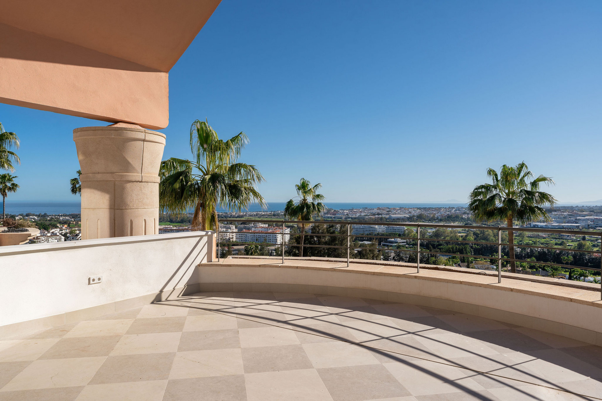 Panoramic view from Magna Marbella penthouse terrace over Nueva Andalucía to the sea